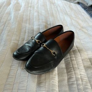 Coach horse buckle loafers